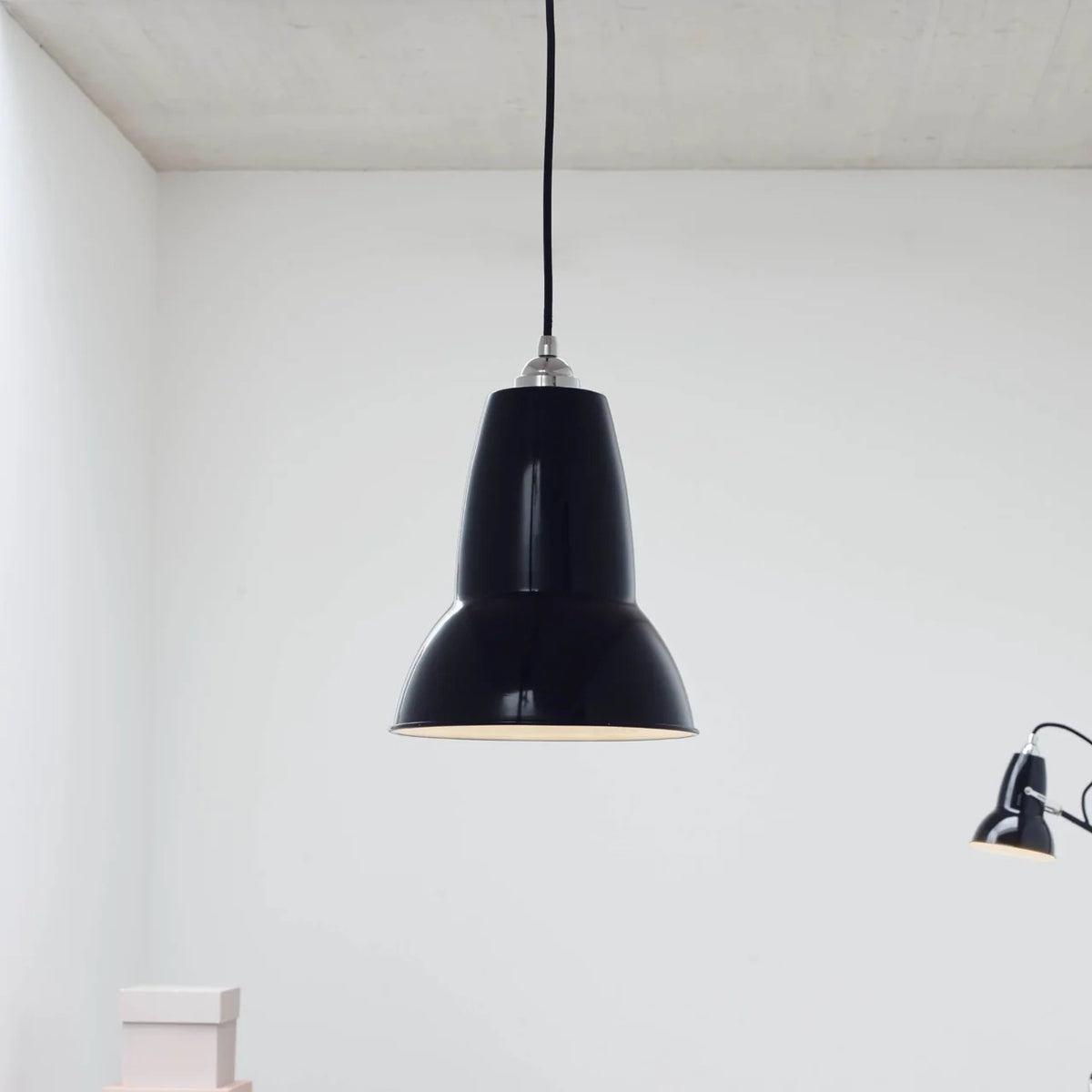 Anglepoise Original 1227 pendant in Jet Black in a white room