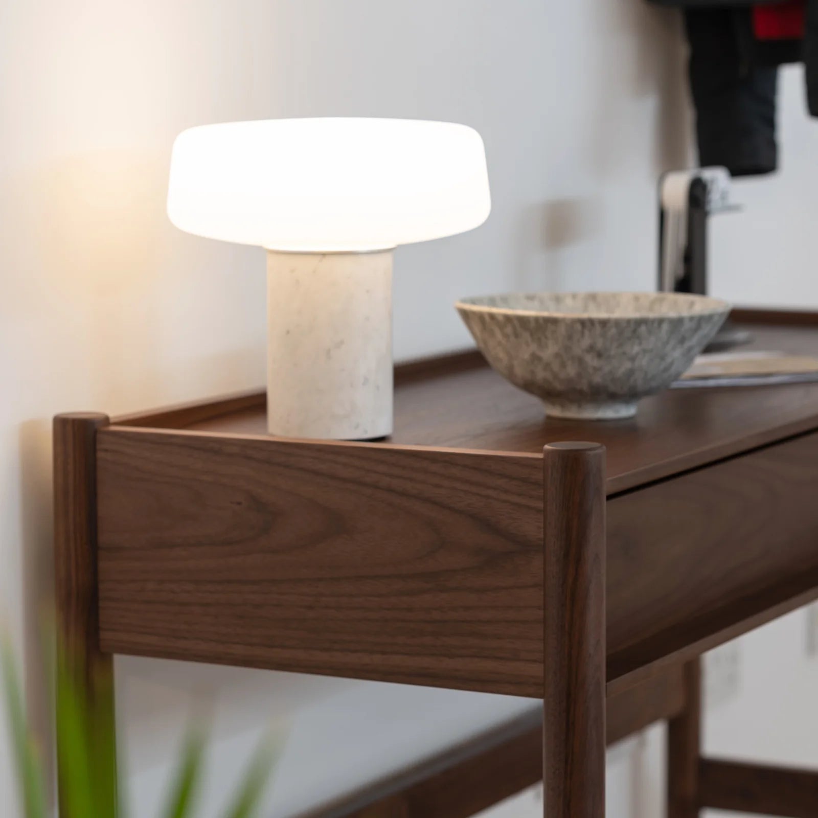 Case Pala console table in FSC-certified walnut styled in interior setting, designed by Shin Azumi.