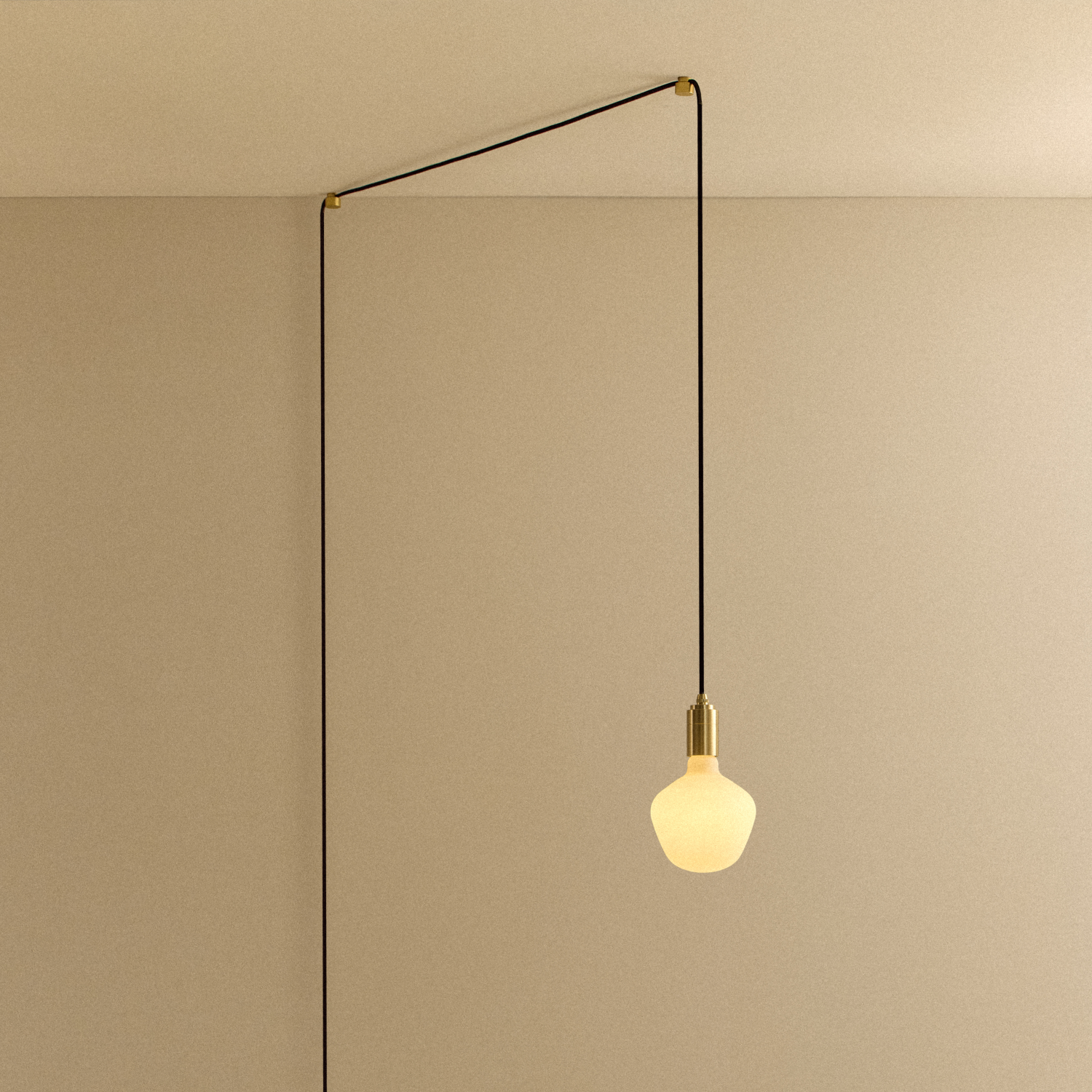 Enno Plug-In Pendant in Brass, front view with fabric cord and matte-white bulb
