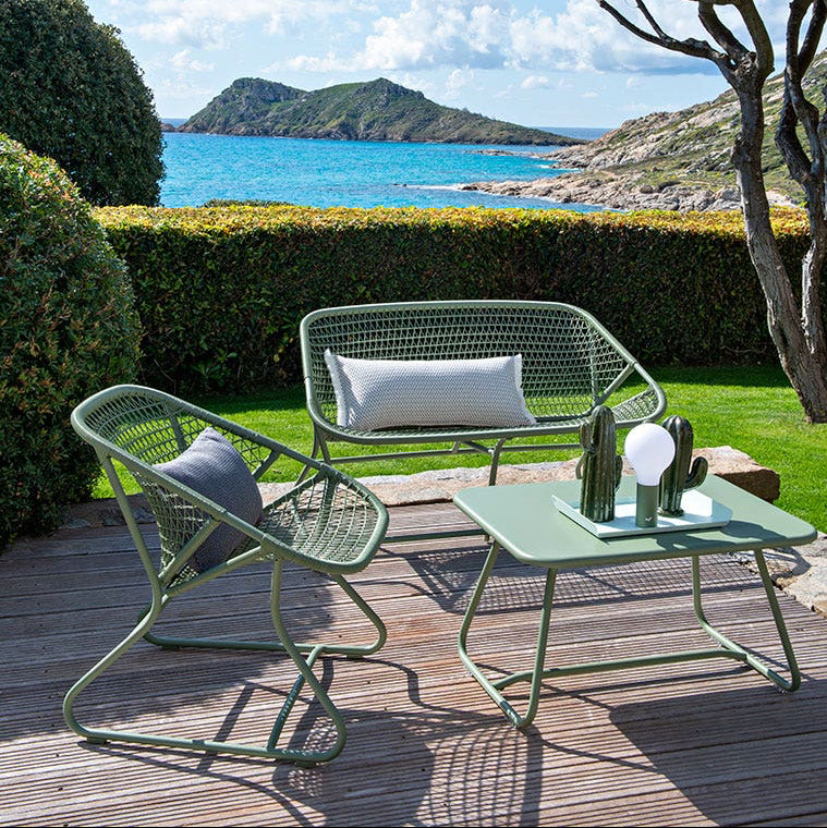 Fermob Sixties Bench in residential garden setting
