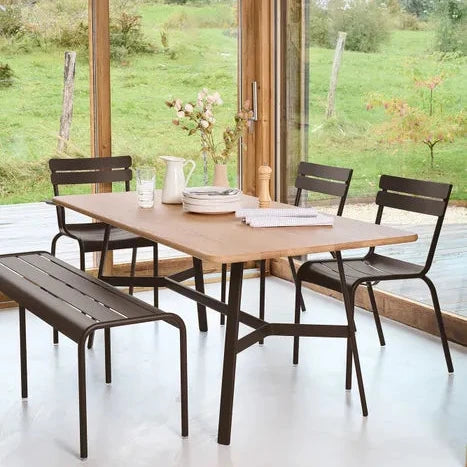 Fermob Luxembourg Side Chair in Cactus styled outdoors, the Luxembourg garden chair