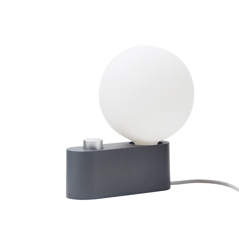 Charcoal Alumina Tala table lamp with dim-to-warm bulb by Comosum, sleek desk lighting