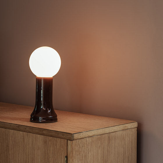 Tala Shore table lamp in Bottle Brown recycled glass in a styled interior