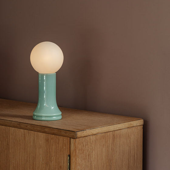 Tala Shore table lamp in Sea Green recycled glass on a side table