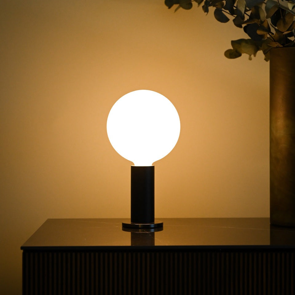 Tala Knuckle table lamp with Sphere IV bulb in Oak, styled in a holiday interior, view 2