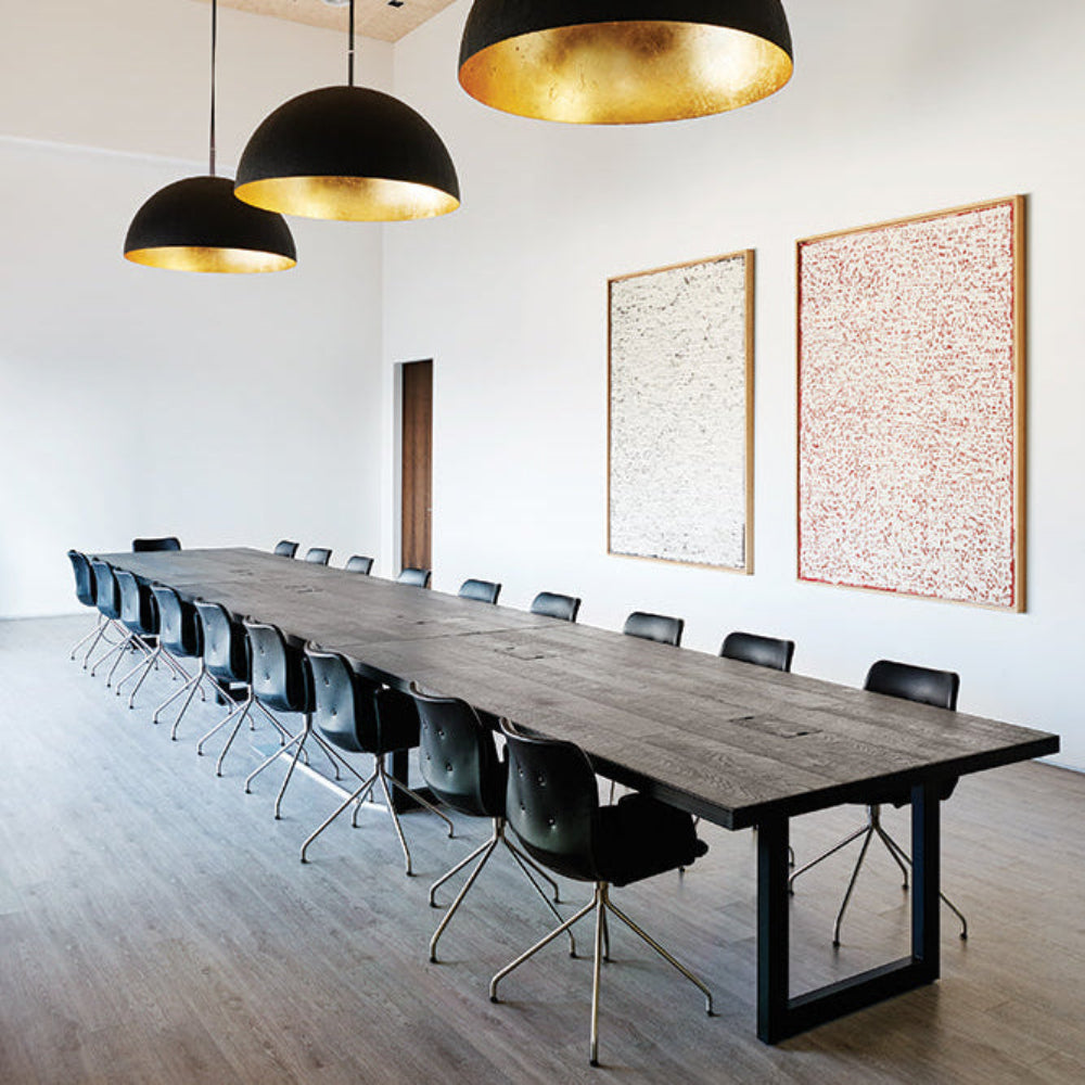 Bent Hansen Primum Swivel Dining Chair with Arms in black leather, stainless steel base, styled in an interior setting