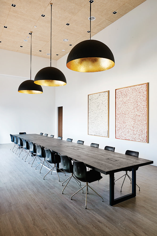 Bent Hansen Primum Swivel Dining Chair with Arms in black leather, black steel base, styled in an interior setting, steel