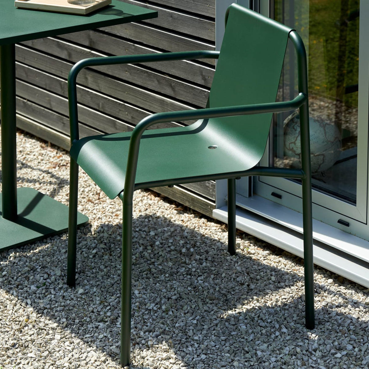 Detail of Tiptoe PANORAMA Outdoor Armchair in Forest Green showing the folded steel seat and armrest