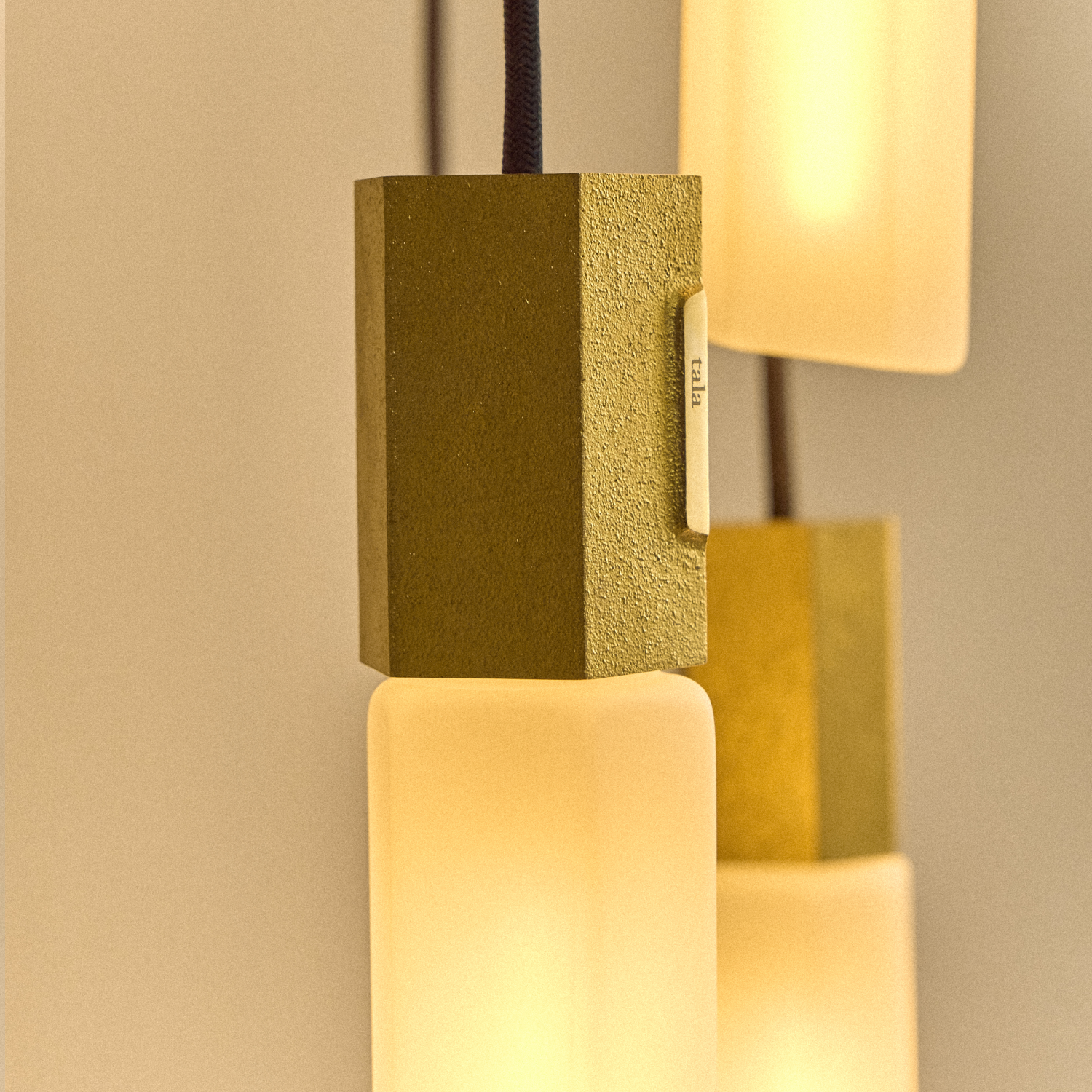 Basalt Single Pendant by Tala in Brass, underside view of the E26 socket and bulb