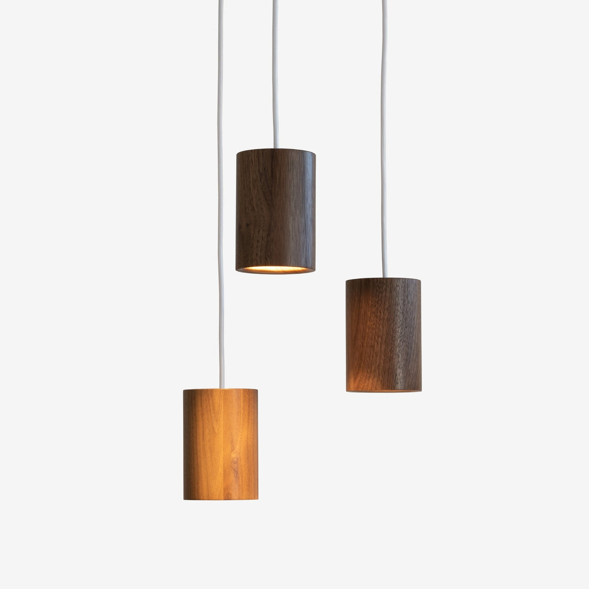Case Solid Three Pendant Cluster in Walnut, staggered cylinders, solid walnut