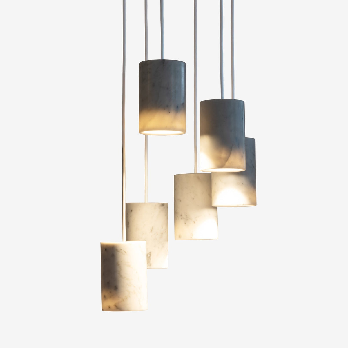Case Solid Six Pendant Cluster in Carrara, staggered cylinders, Carrara marble