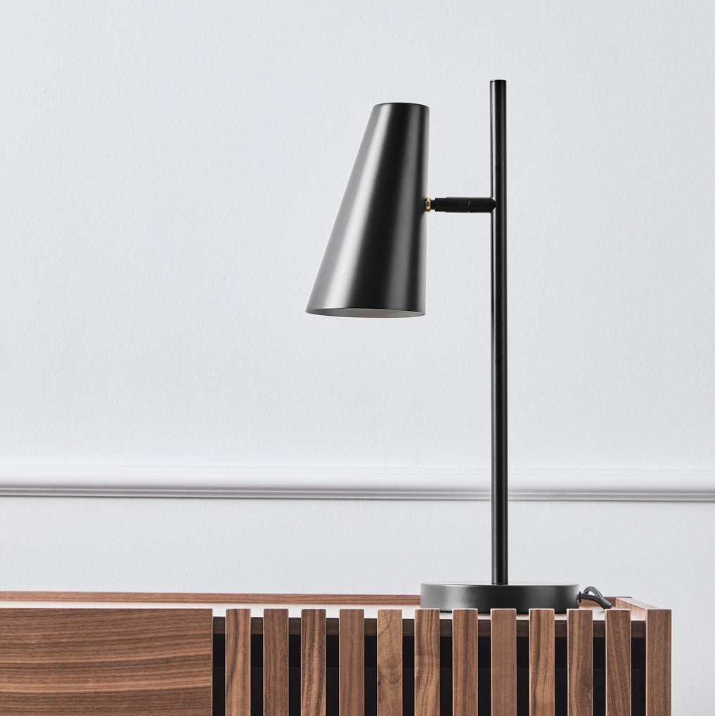 WOUD Cono Table Lamp in powder-coated steel styled in a living room