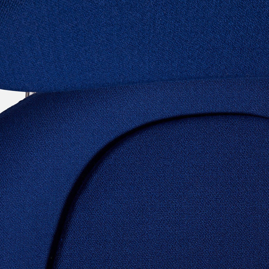 Close-up of the WOUD Meadow Lounge Chair in blue Kvadrat Vidar fabric