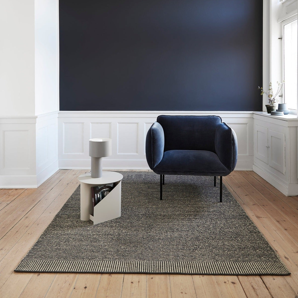 WOUD Rombo Rug in hand-tufted wool styled in a living room