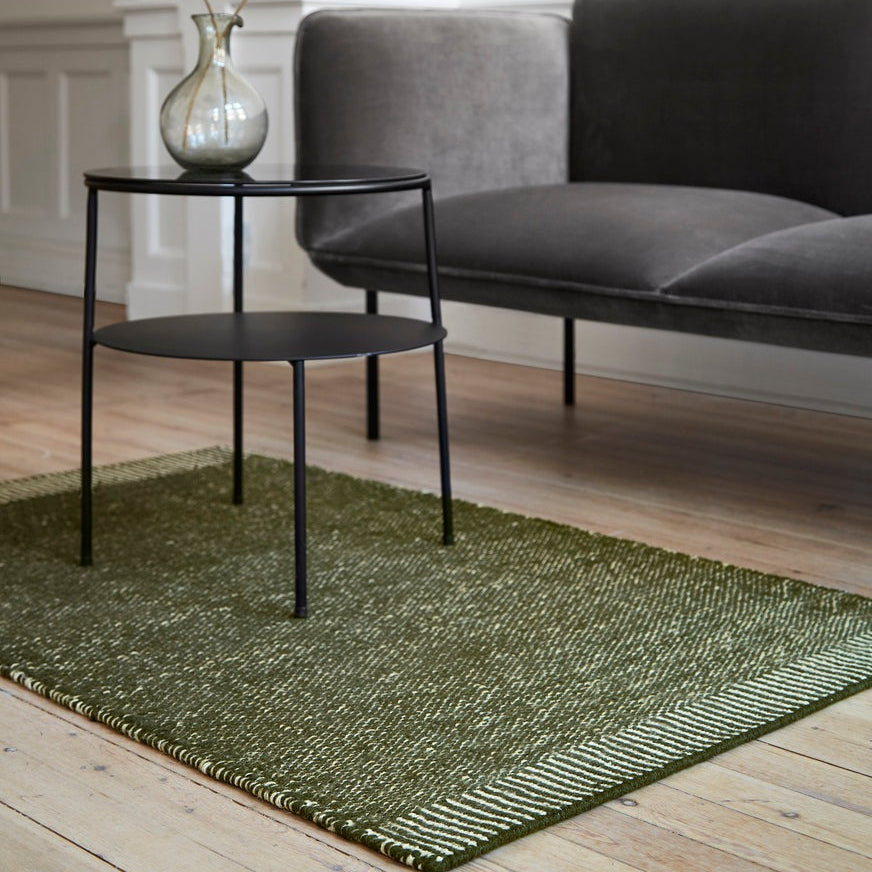 WOUD Rombo Rug in hand-tufted wool styled in a living room