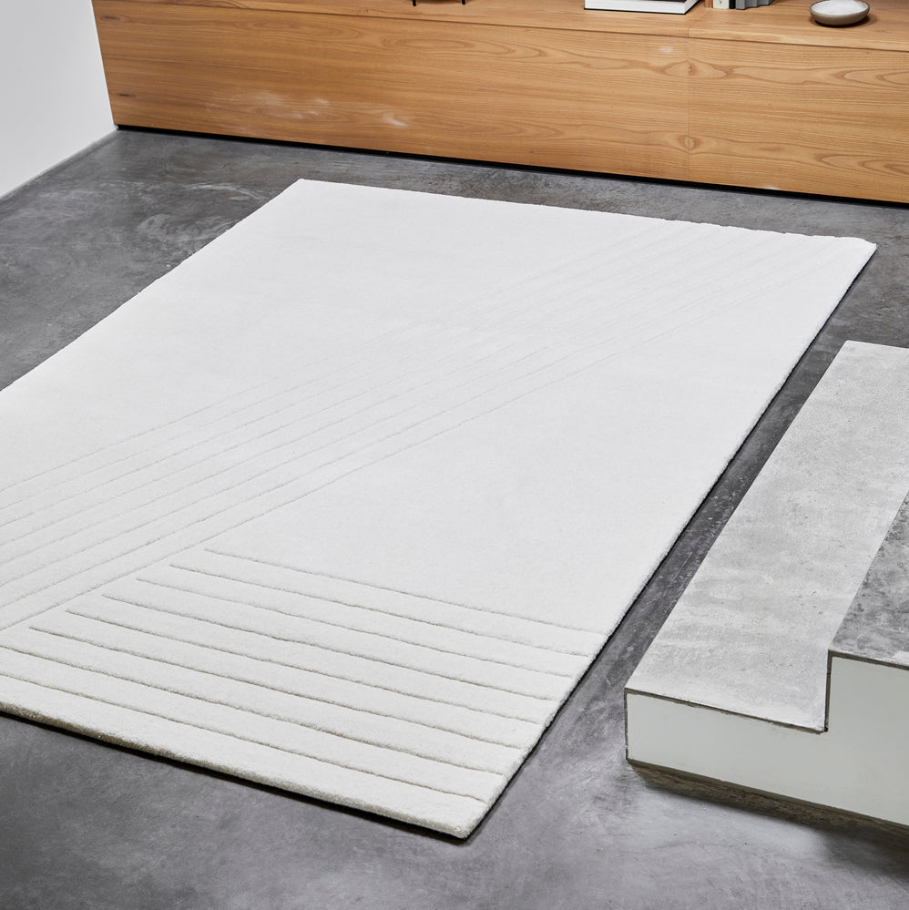 WOUD Kyoto Rectangular Rug in hand-tufted wool styled in a living room