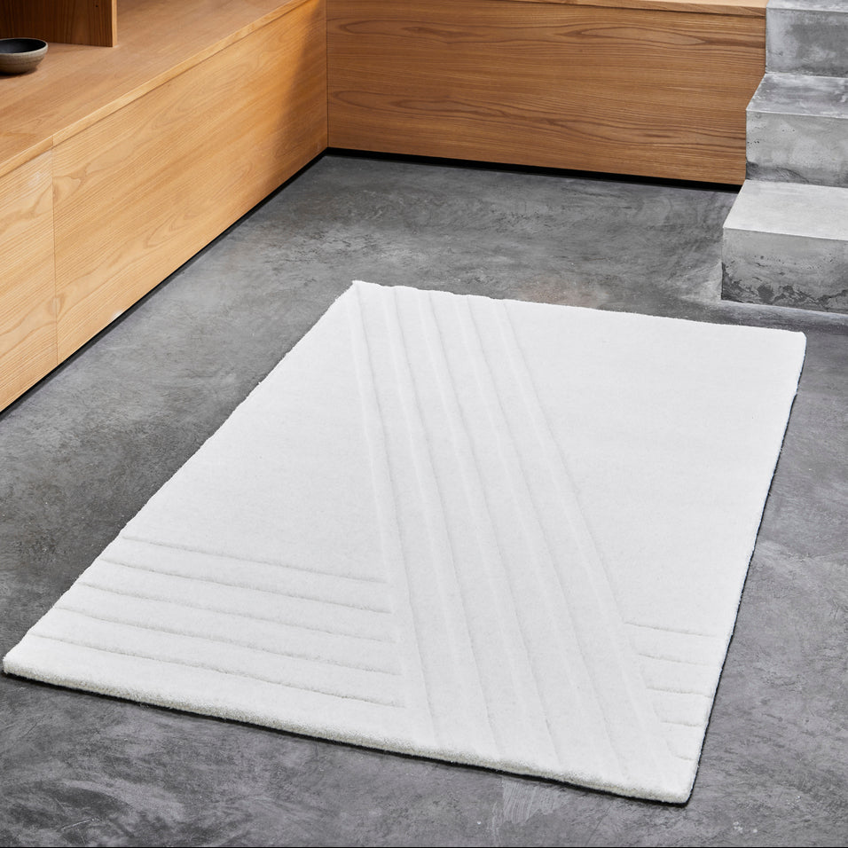 WOUD Kyoto Rectangular Rug in hand-tufted wool styled in a living room