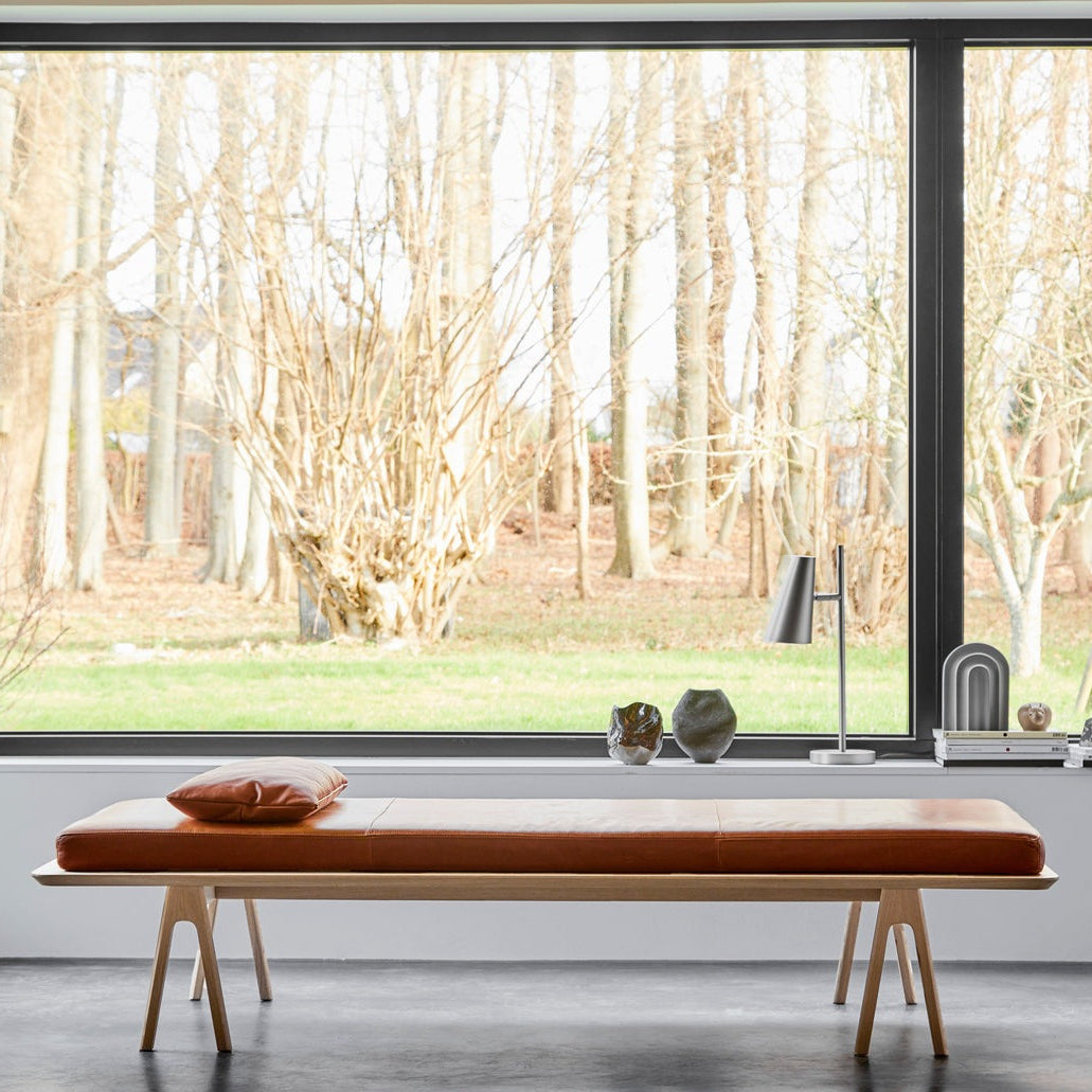 WOUD Cono Table Lamp in powder-coated steel styled in a living room