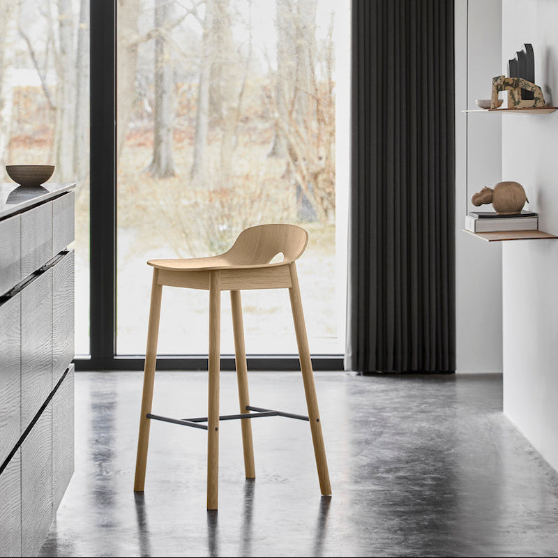 WOUD Mono Counter Chair in light wood in a minimalist kitchen