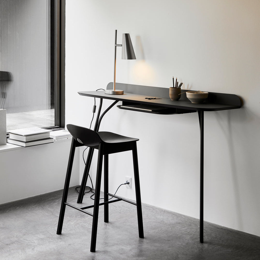 WOUD Cono Table Lamp in powder-coated steel styled in a living room