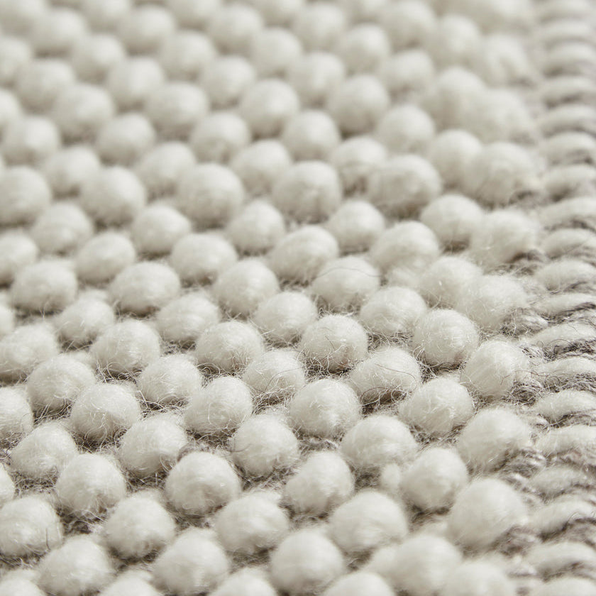 WOUD Tact Rug in white hand-tufted wool designed by Studio Tolvanen