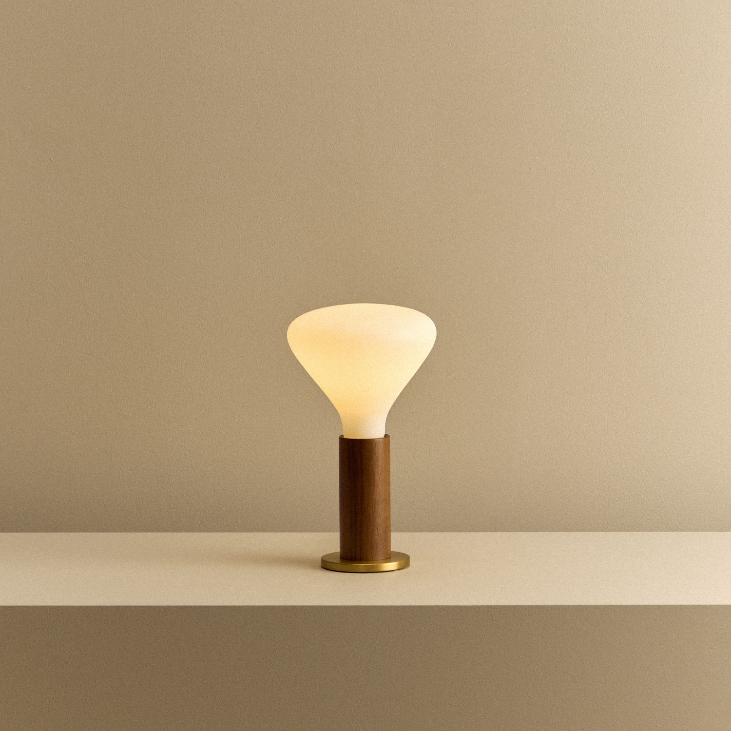 Knuckle Table Lamp in Walnut with Noma bulb, illuminated