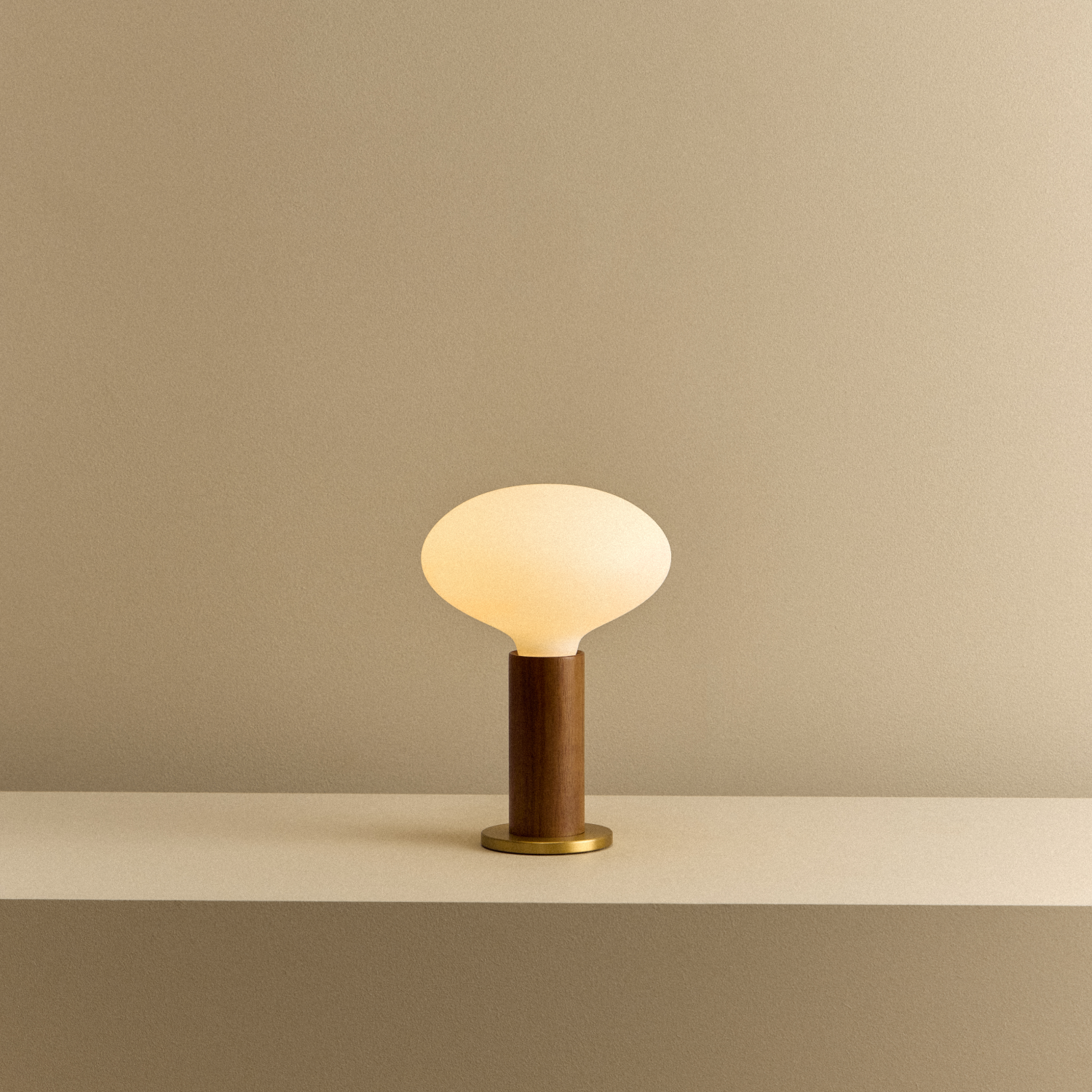 Knuckle Table Lamp in Walnut with Oval bulb, illuminated