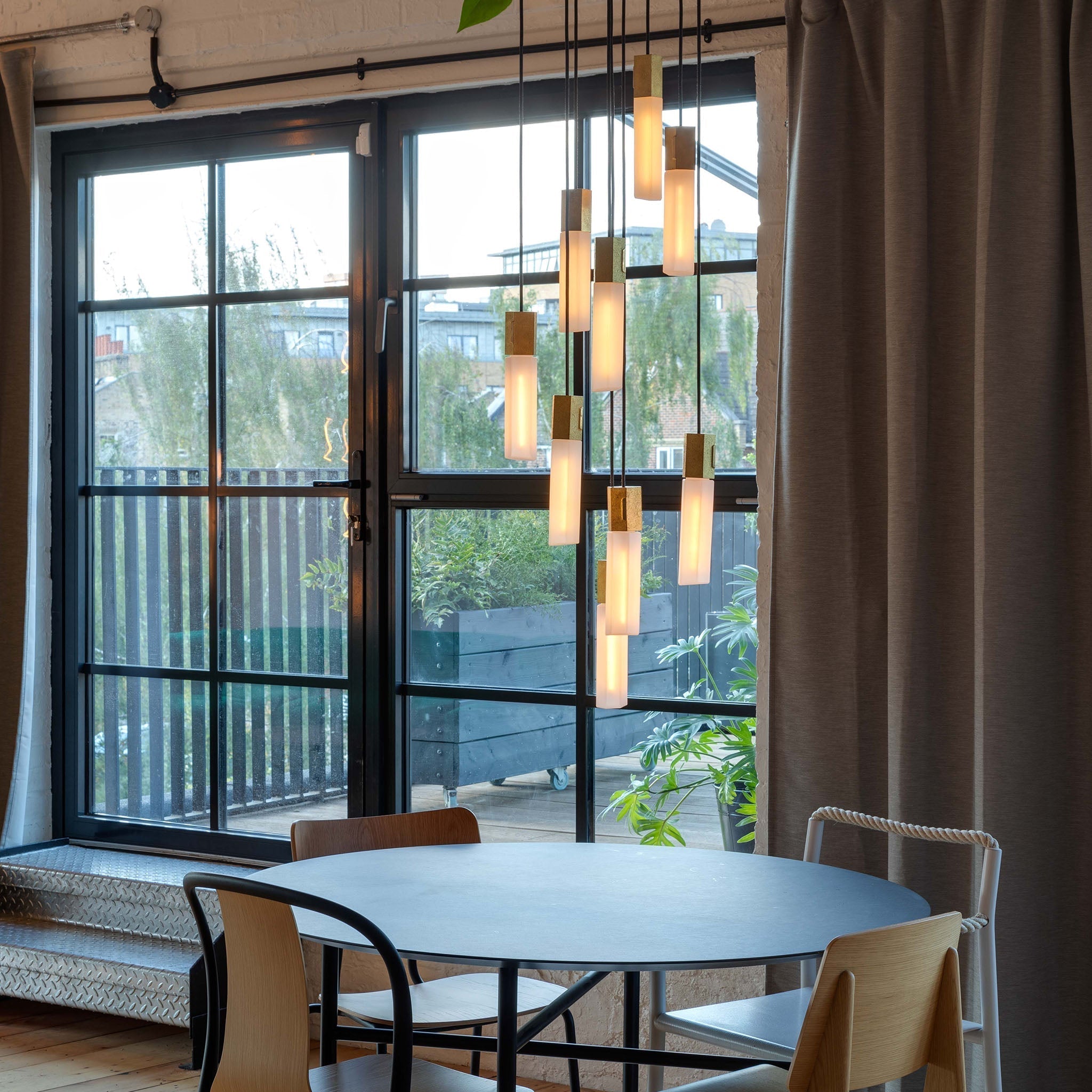Basalt Nine Pendant by Tala in Brass, full fixture shown on a white background
