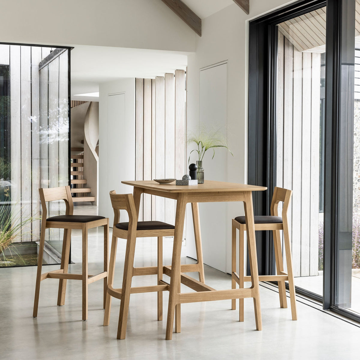 Case Dulwich Bar Table in Oak with bar stools, styled in an interior setting, solid oak