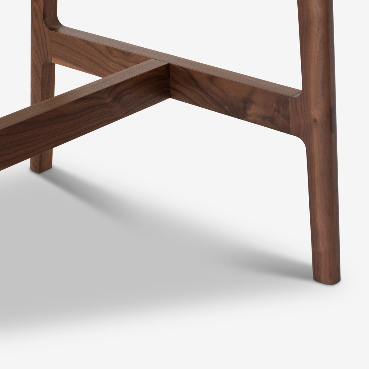 Detail of Case Dulwich Bar Table showing the solid walnut leg and stretcher joint