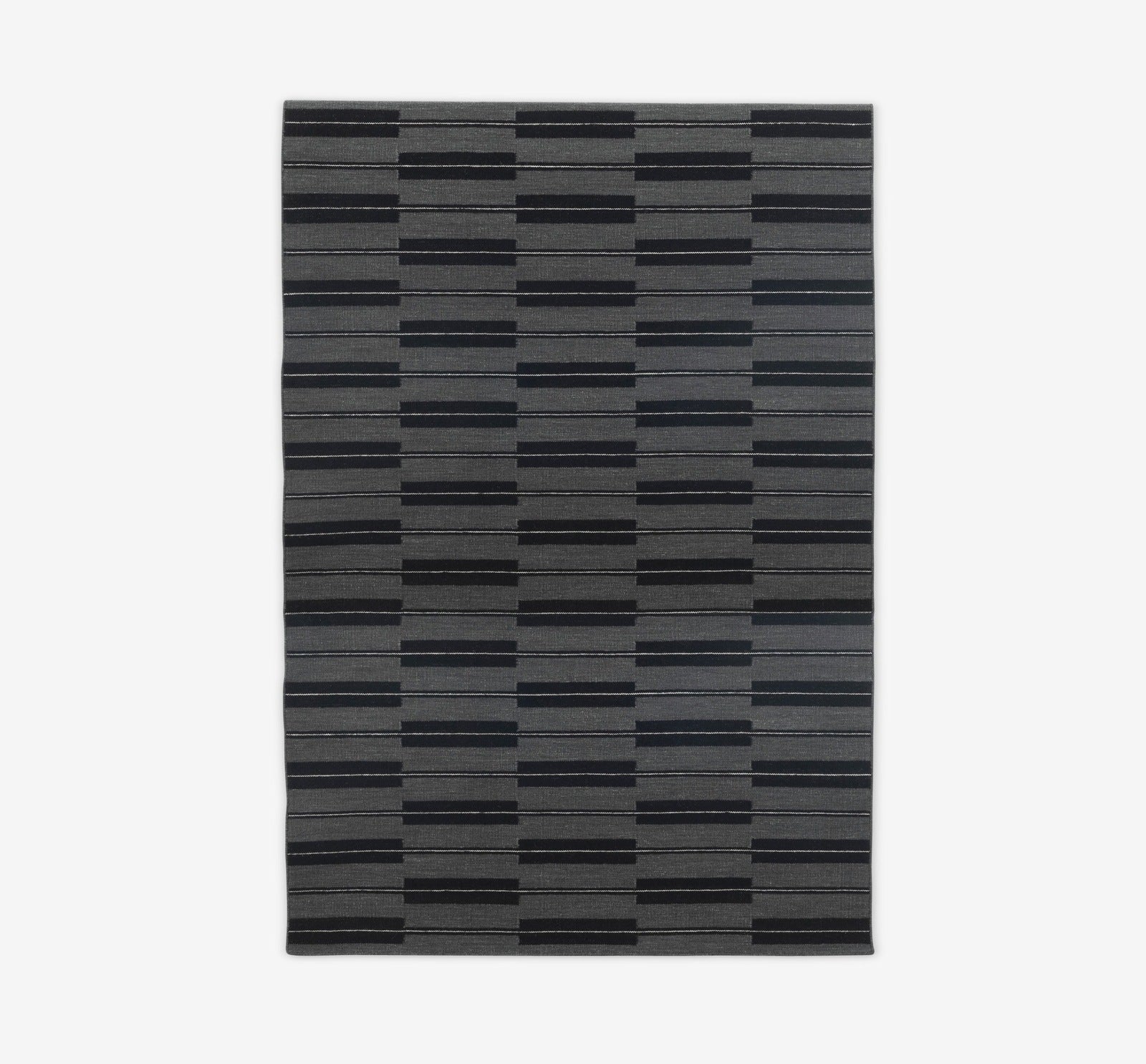 Spindle rug in flannel grey by Eleanor Pritchard for Case furniture with Comosum design