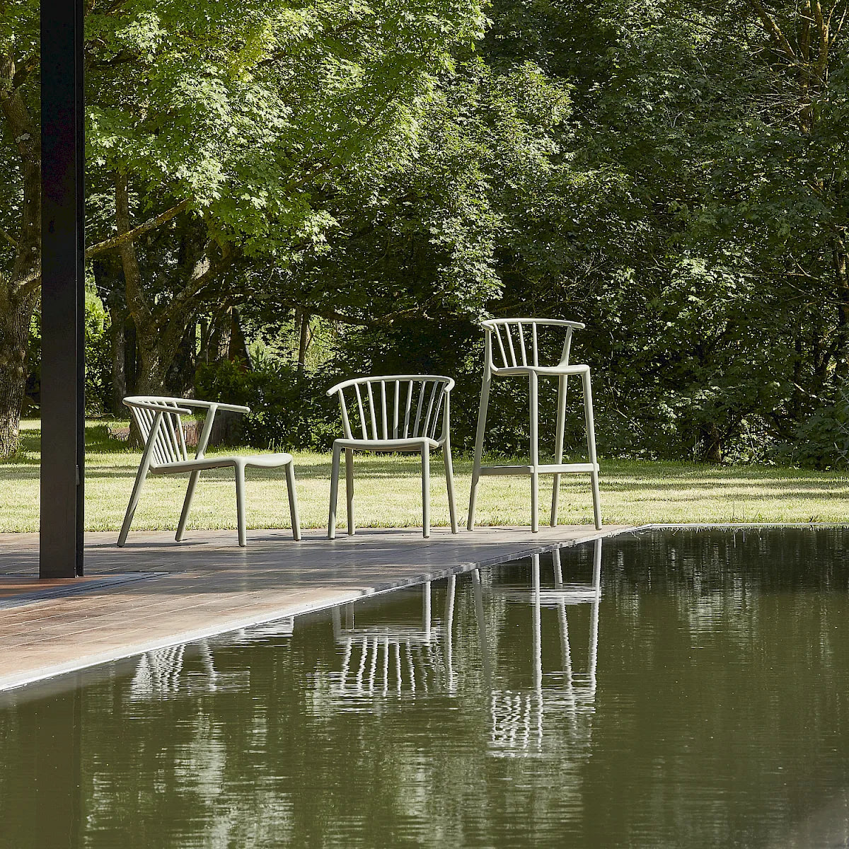 Resol Woody Lounge Chair with Woody chairs and bar stools in Green Grey by a pool, polypropylene with fiberglass