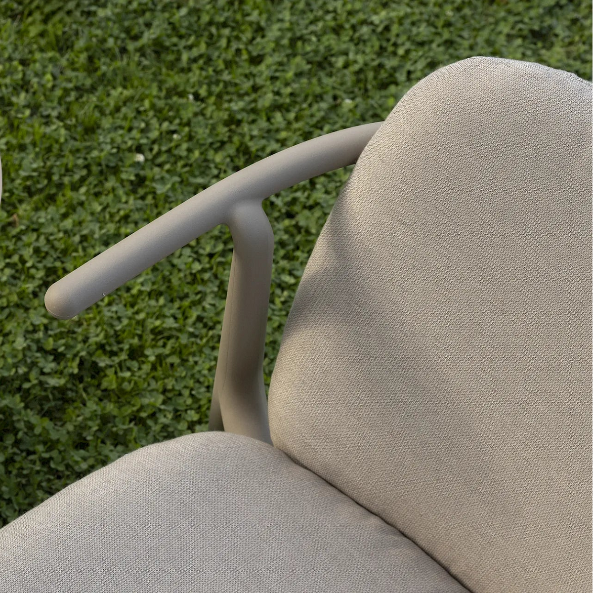 Detail of Resol Woody Lounge Chair showing the arm and optional seat and back cushion