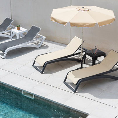 Resol Sky Club Sun Loungers beside a pool, styled in an outdoor setting, polypropylene with fiberglass and Textilene