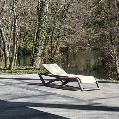 Resol Sky Club Sun Lounger on a terrace by the trees, styled in an outdoor setting, polypropylene with fiberglass