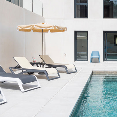 Resol Sky Club Sun Loungers by a pool with a parasol, styled in an outdoor setting, Textilene sling