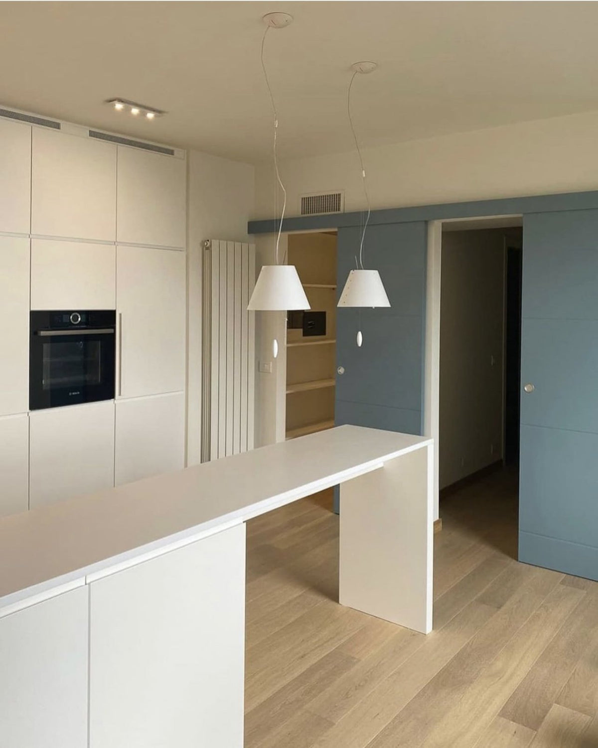 Luceplan Costanzina Pendants over a kitchen counter