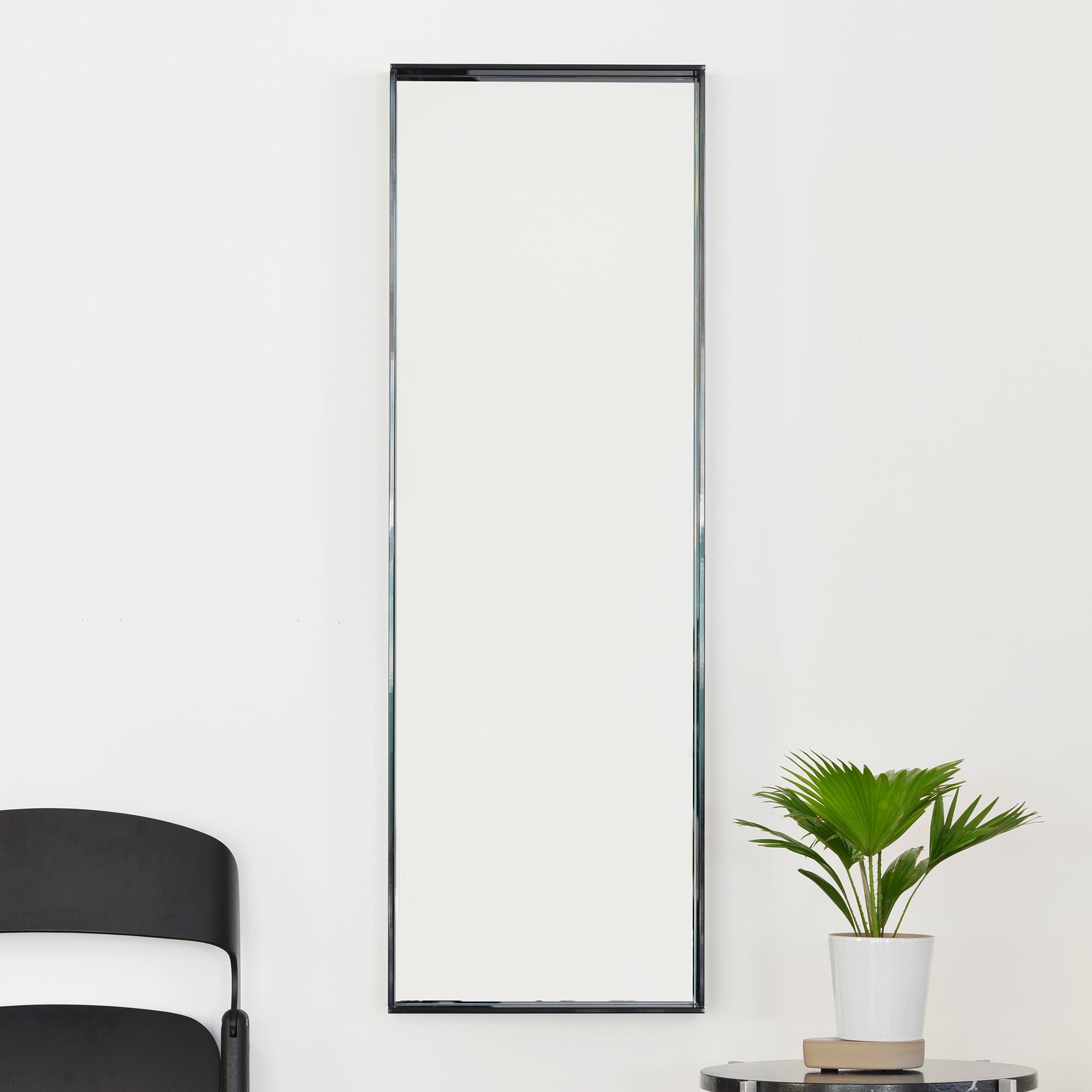 Lucent Tall Mirror in Smoke styled in modern interior
