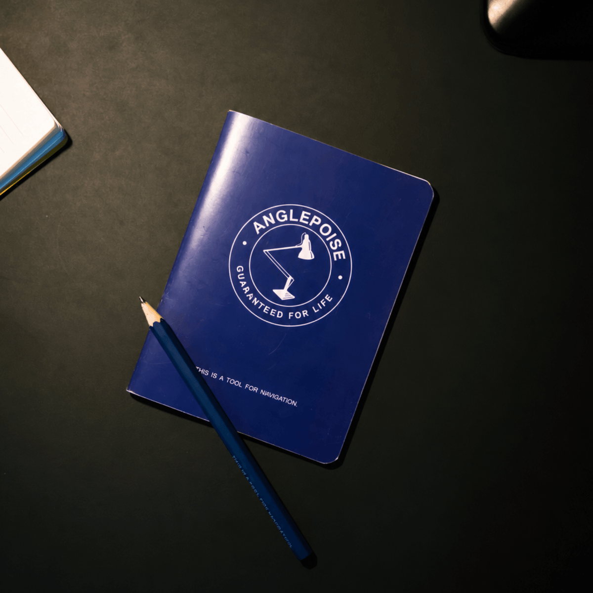 Notebook and pencil included with the Anglepoise Original 315 Desk Lamp Navigation Edition