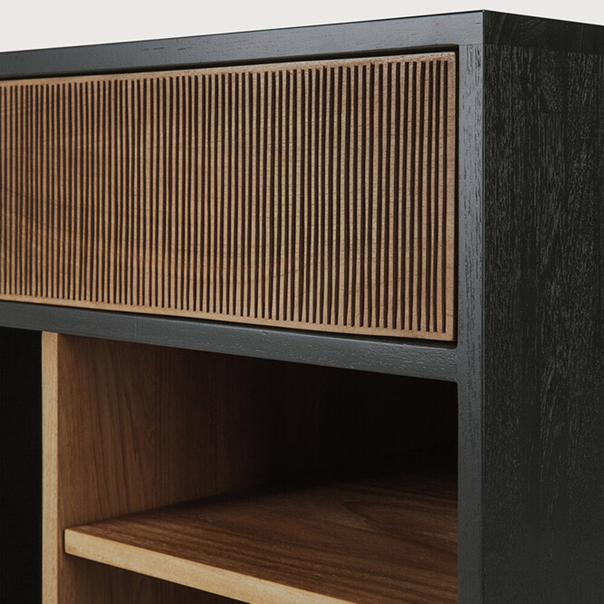 Detail of Ethnicraft Oscar Drawer Unit showing the hand-carved natural teak drawer front