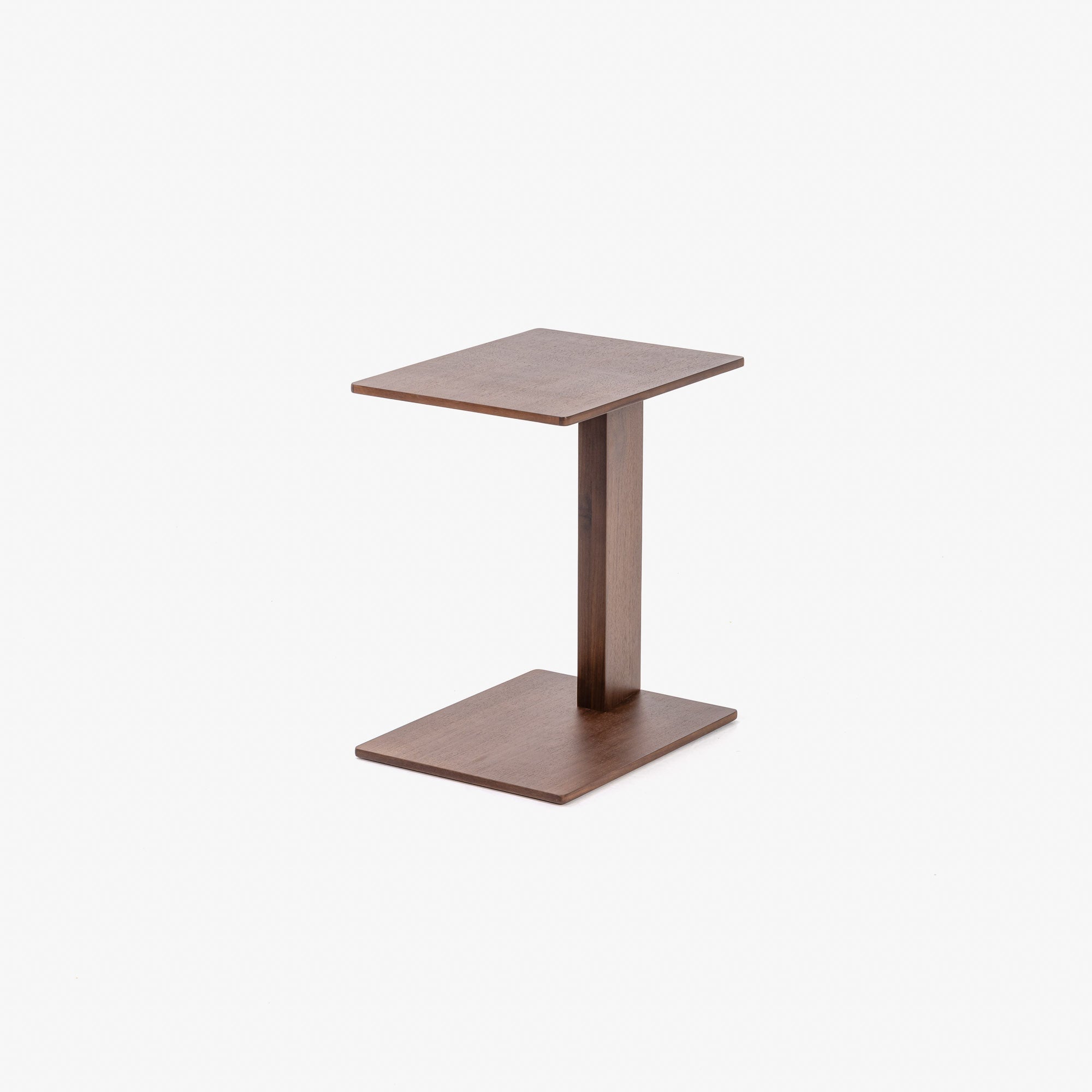 Case Overhang rectangular side table in FSC-certified walnut, designed by Matthew Hilton.