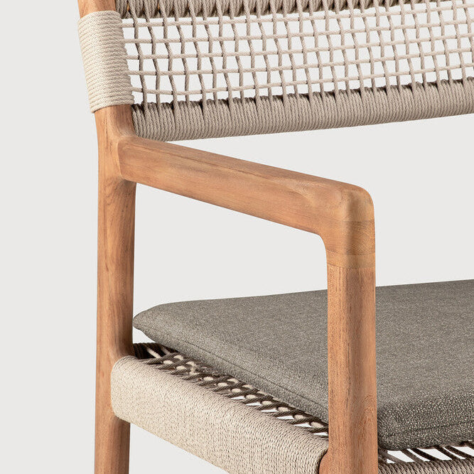 Ethnicraft Jack Woven Outdoor Dining Chair in teak styled in a dining room