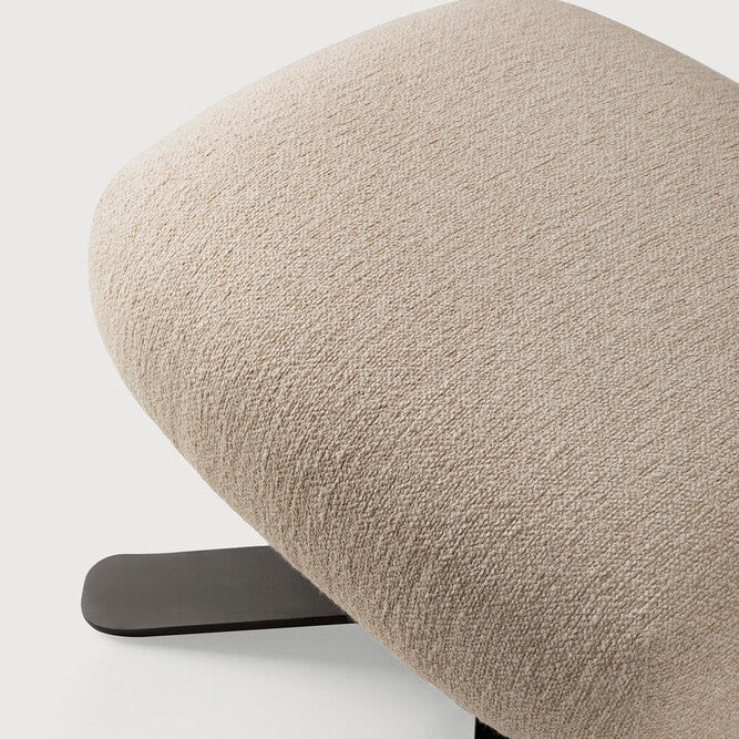Detail of Ethnicraft Merge Footstool showing the upholstered edge and metal base
