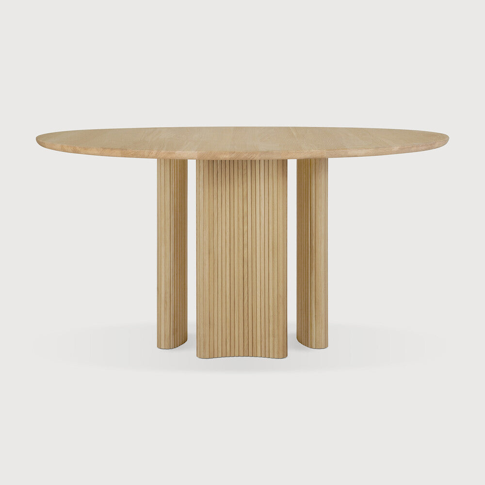 Ethnicraft Roller Max Dining Table in oak styled in a dining room