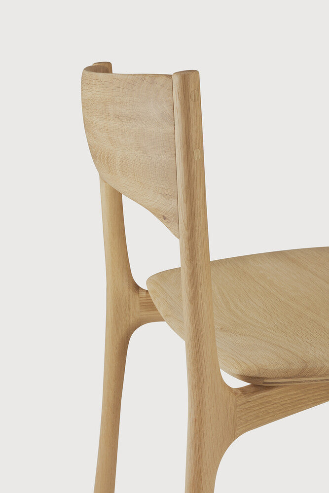 Ethnicraft Pi Dining Chair in oak styled in a dining room
