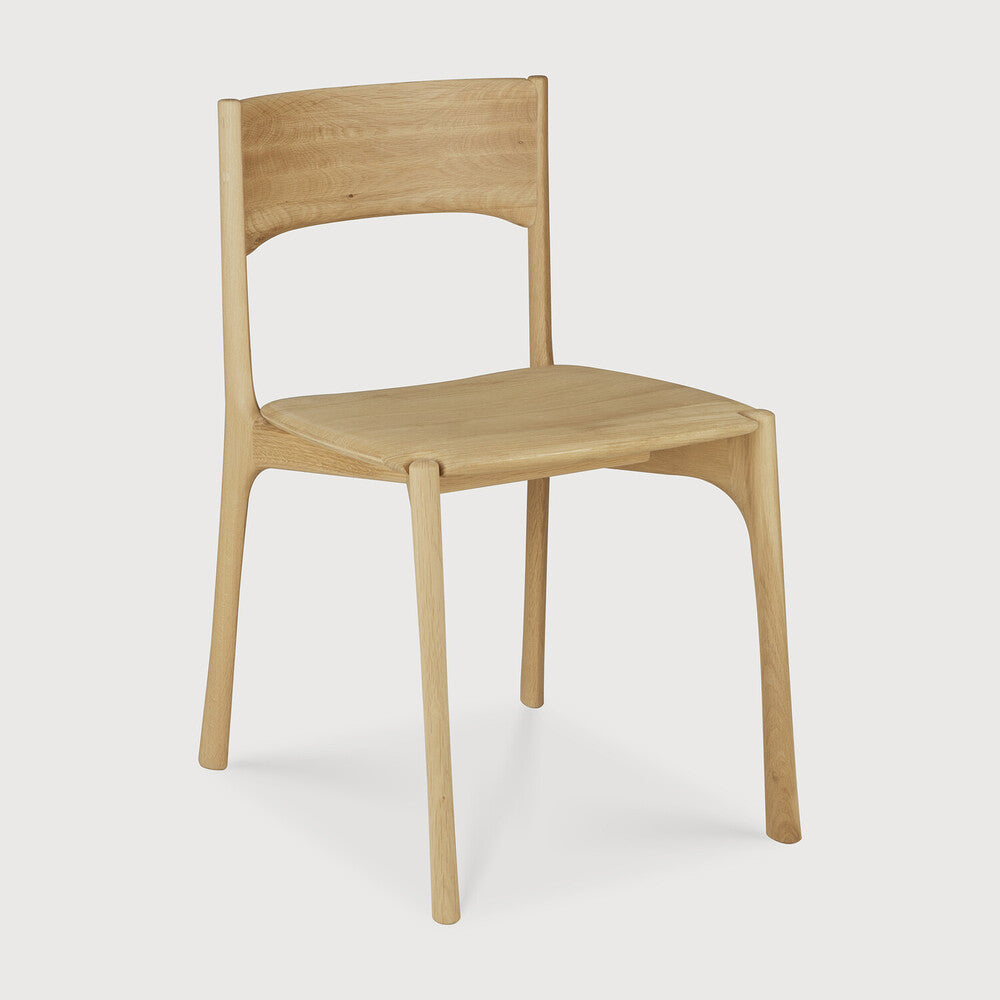 Ethnicraft Pi Dining Chair in oak styled in a dining room