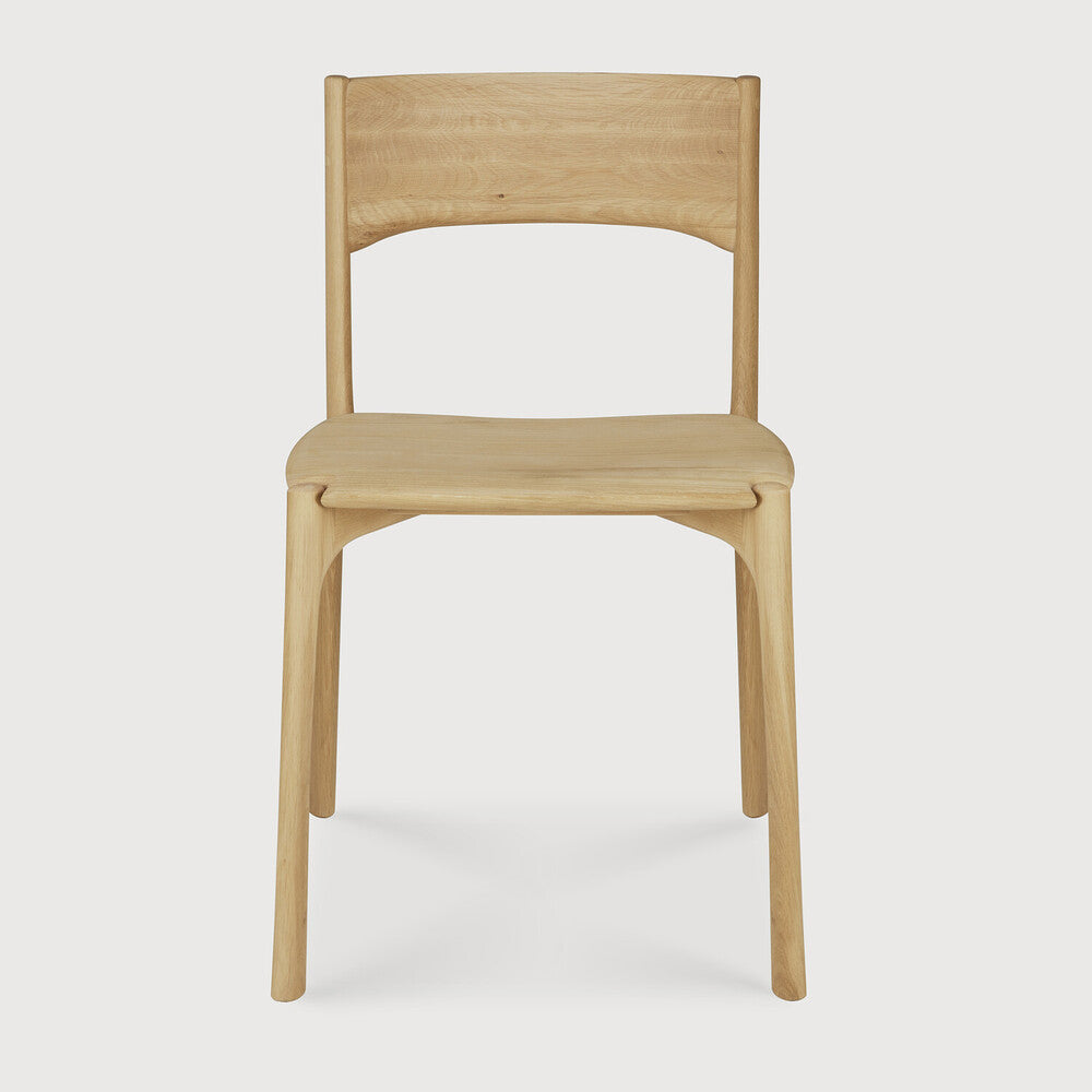 Ethnicraft Pi Dining Chair in oak styled in a dining room