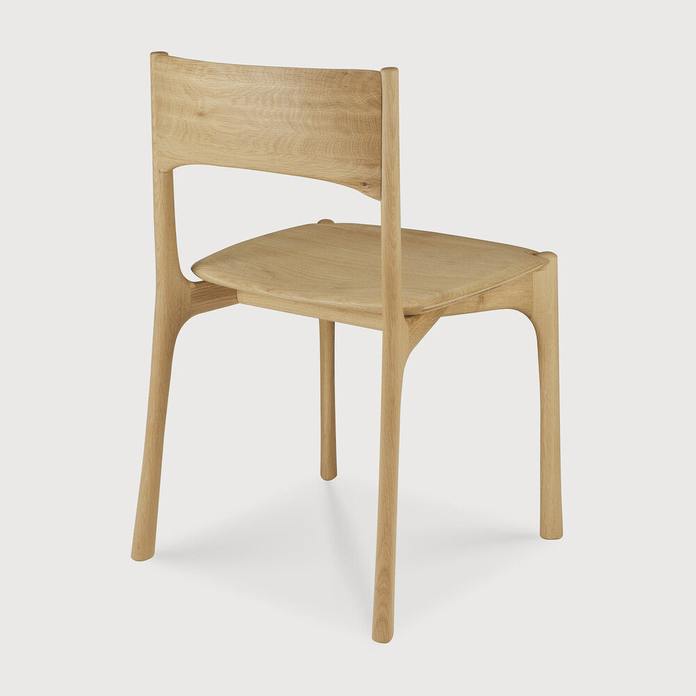 Ethnicraft Pi Dining Chair in oak styled in a dining room