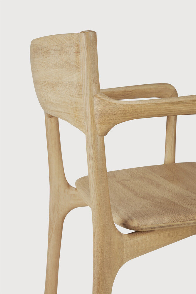 Ethnicraft Pi Dining Chair in oak styled in a dining room