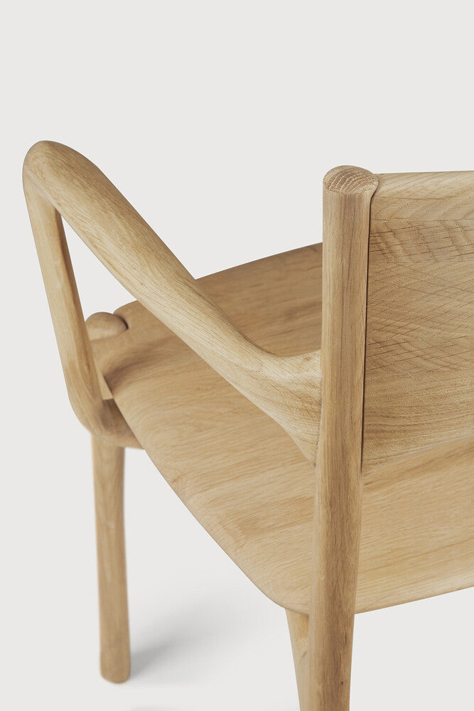 Ethnicraft Pi Dining Chair in oak styled in a dining room